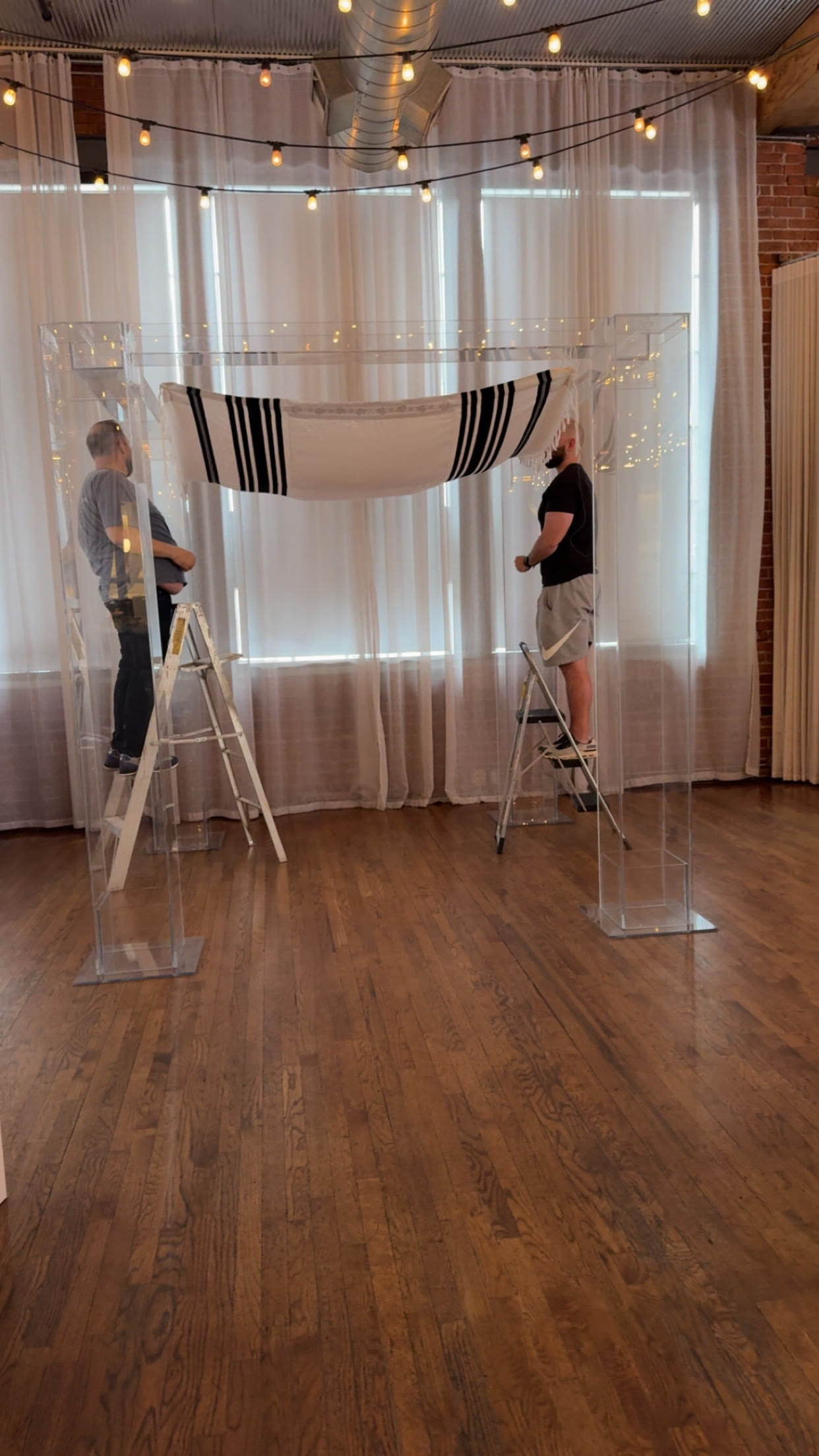 The family setting up the tallit canopy
